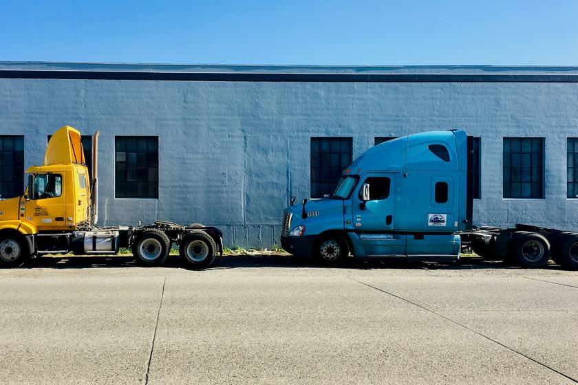 Two semi tractors parked without trailers